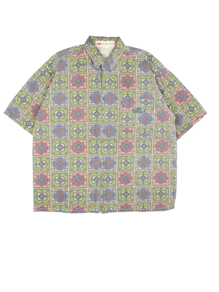 Quiksilver Patterned Short Sleeve Surf Shirt in a green, blue and red colourway, button up and has a chest pocket with the logo embroidered on the front.