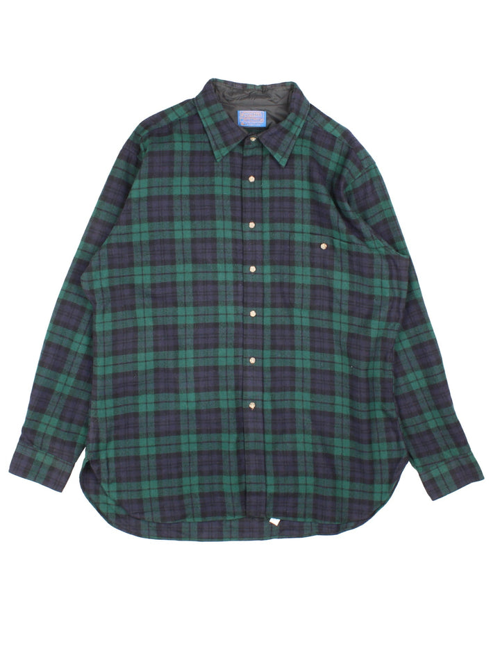 Pendleton Flannel Shirt in a green, blue and black plaid colourway, button up, has a chest pocket, and brown elbow pads.