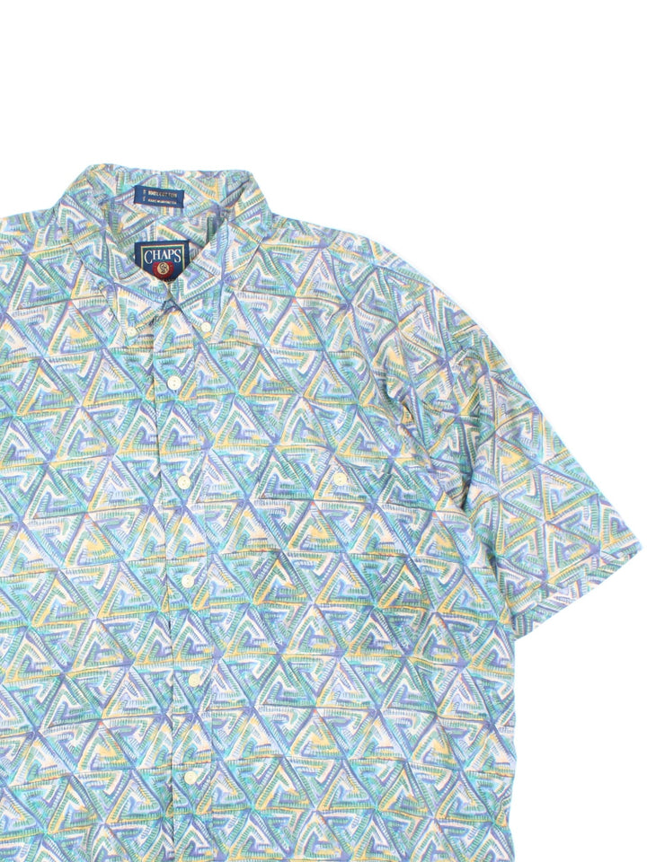 Chaps Ralph Lauren Shirt in a blue patterned colourway, button up and has a chest pocket, triangle patterns printed all over .