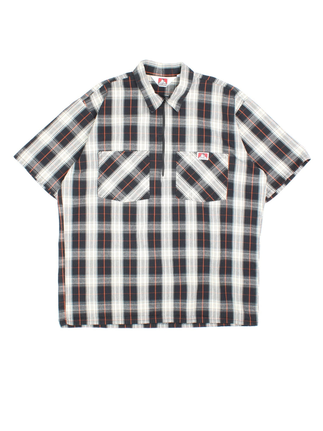 Ben Davis Work Shirt in a black, white, grey and orange plaid colourway, half zip pullover, and has double chest pockets with the logo embroidered on the front.