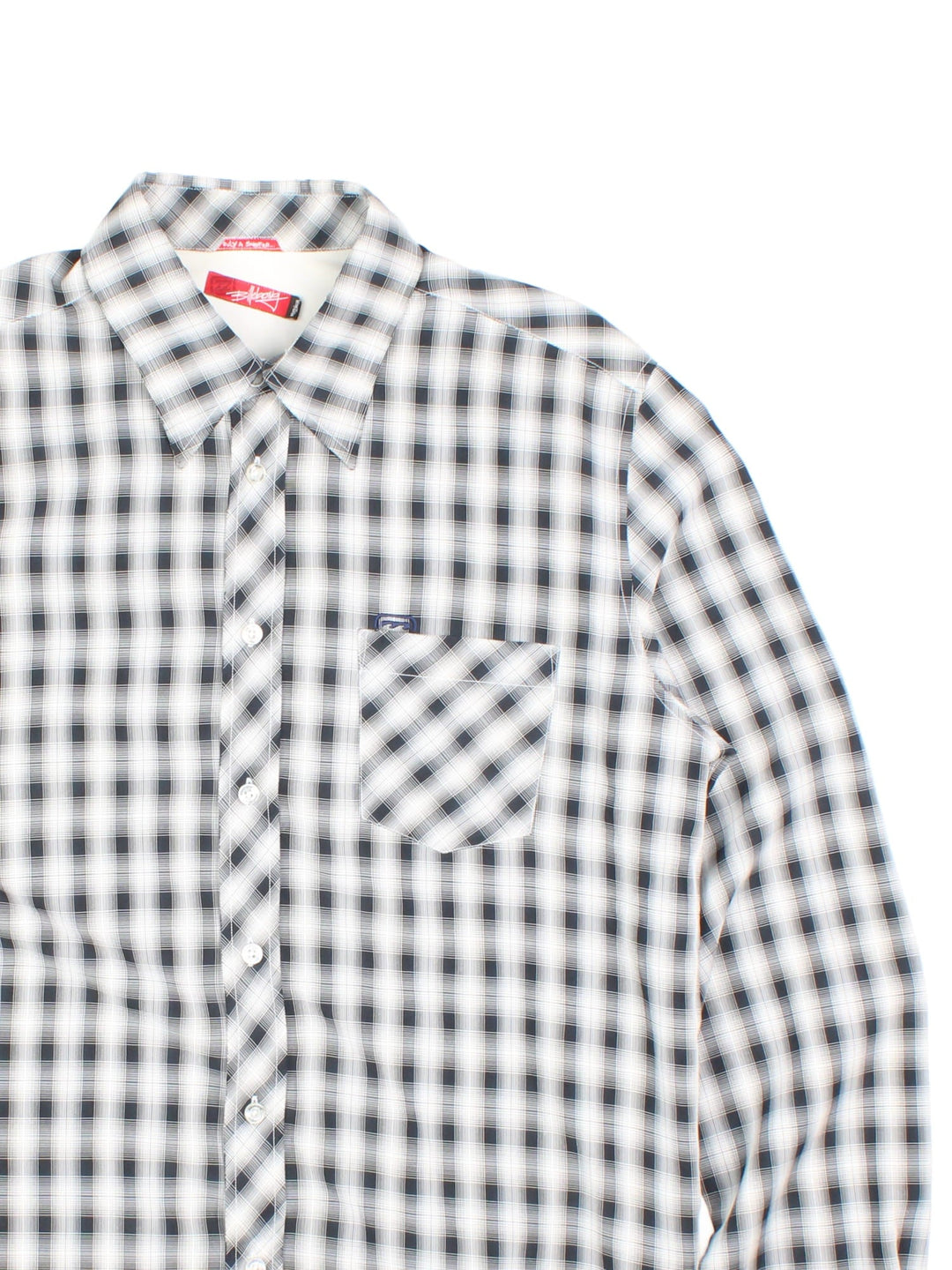 Billabong Checkered Shirt in a white and black colourway, button up and has a chest pocket with the logo embroidered on the front and left sleeve.