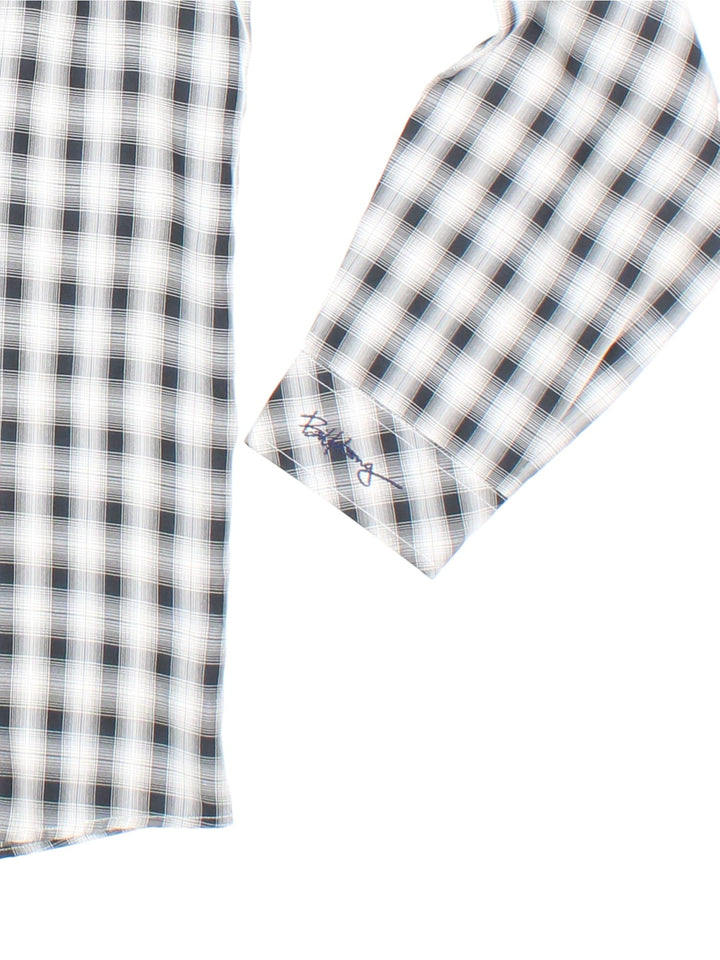 Billabong Checkered Shirt in a white and black colourway, button up and has a chest pocket with the logo embroidered on the front and left sleeve.