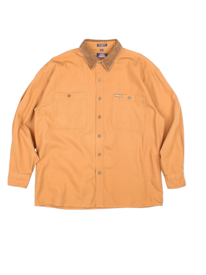 Dickies Work Overshirt in a brown colourway with a corduroy collat, button up and has double chest pockets with the logo embroidered on the front.