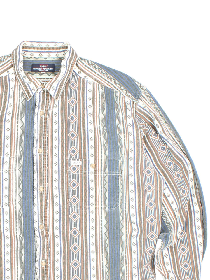 Guess by Georges Marciano Aztec Patterned Shirt in a brown, white and blue colourway, button up and has double chest pockets with the logo embroidered on the front.