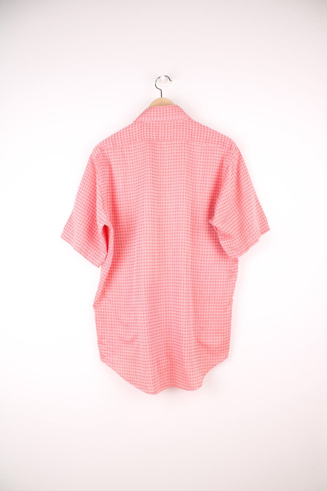 Vintage 70s pink and red patterned shirt with a dagger collar and pocket on the chest. 