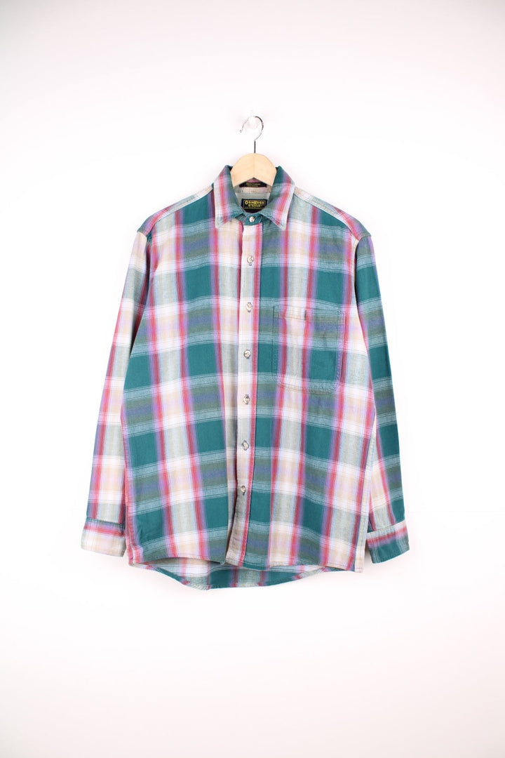 Vintage Oshkosh B'gosh plaid shirt in green, red, beige and purple. Features pocket on the chest. 