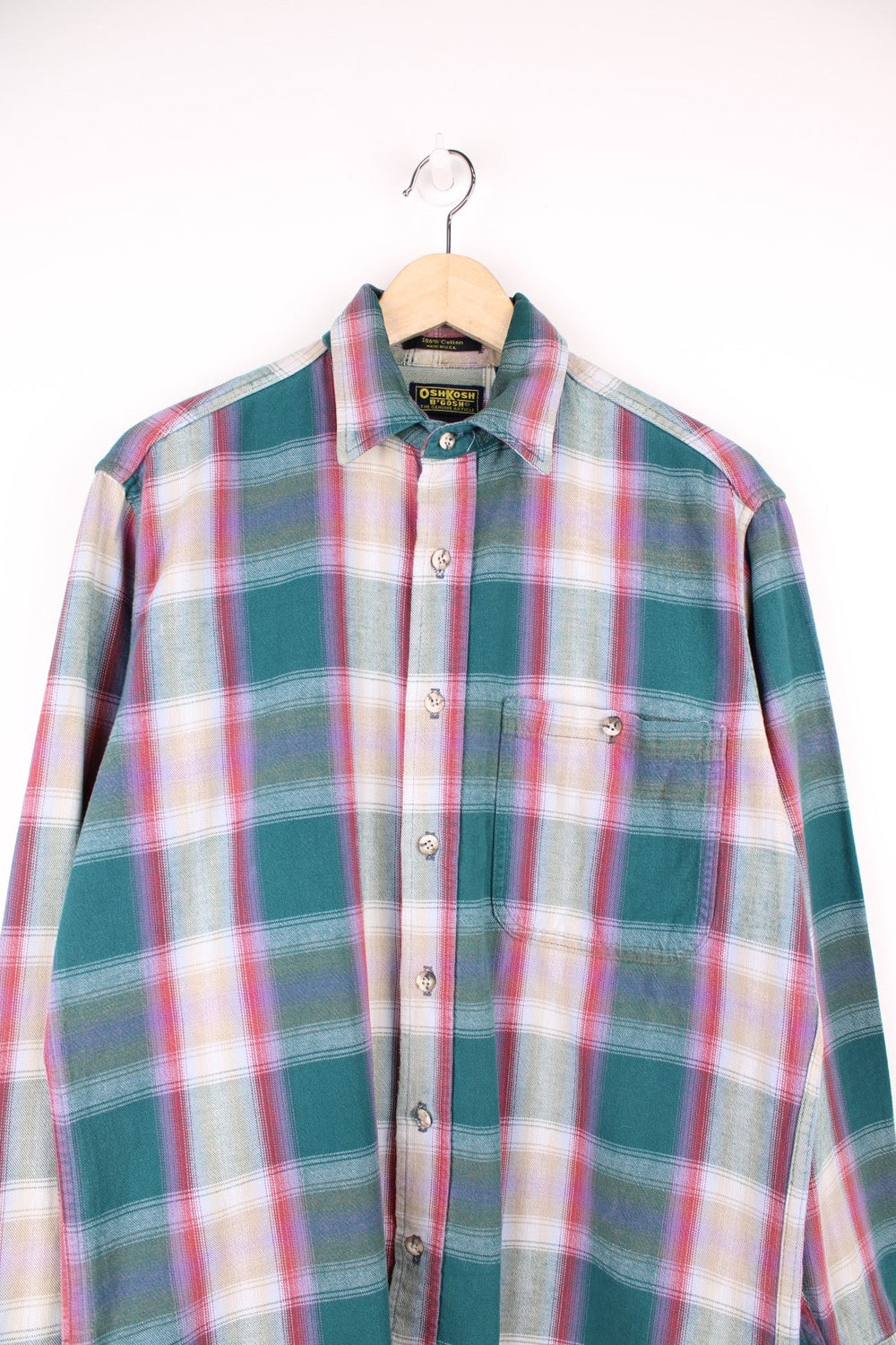 Vintage Oshkosh B'gosh plaid shirt in green, red, beige and purple. Features pocket on the chest. 