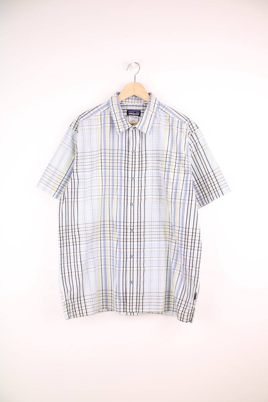 Patagonia plaid button through shirt in white, green, black and blue with chest pocket. 