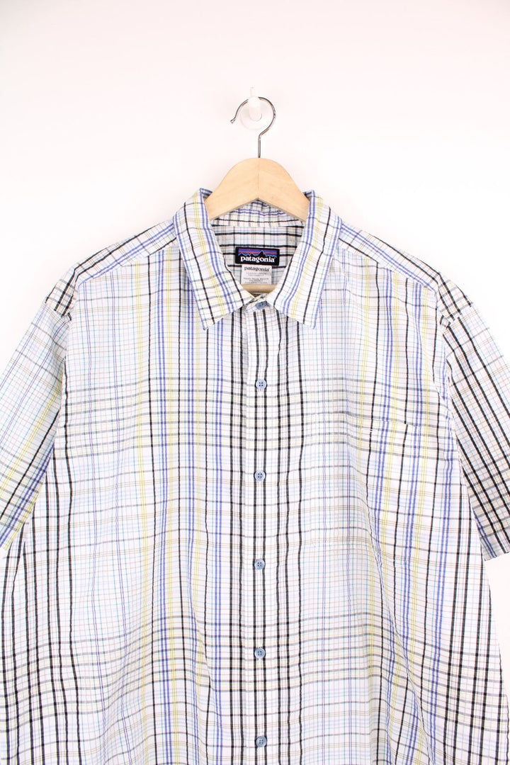 Patagonia plaid button through shirt in white, green, black and blue with chest pocket. 