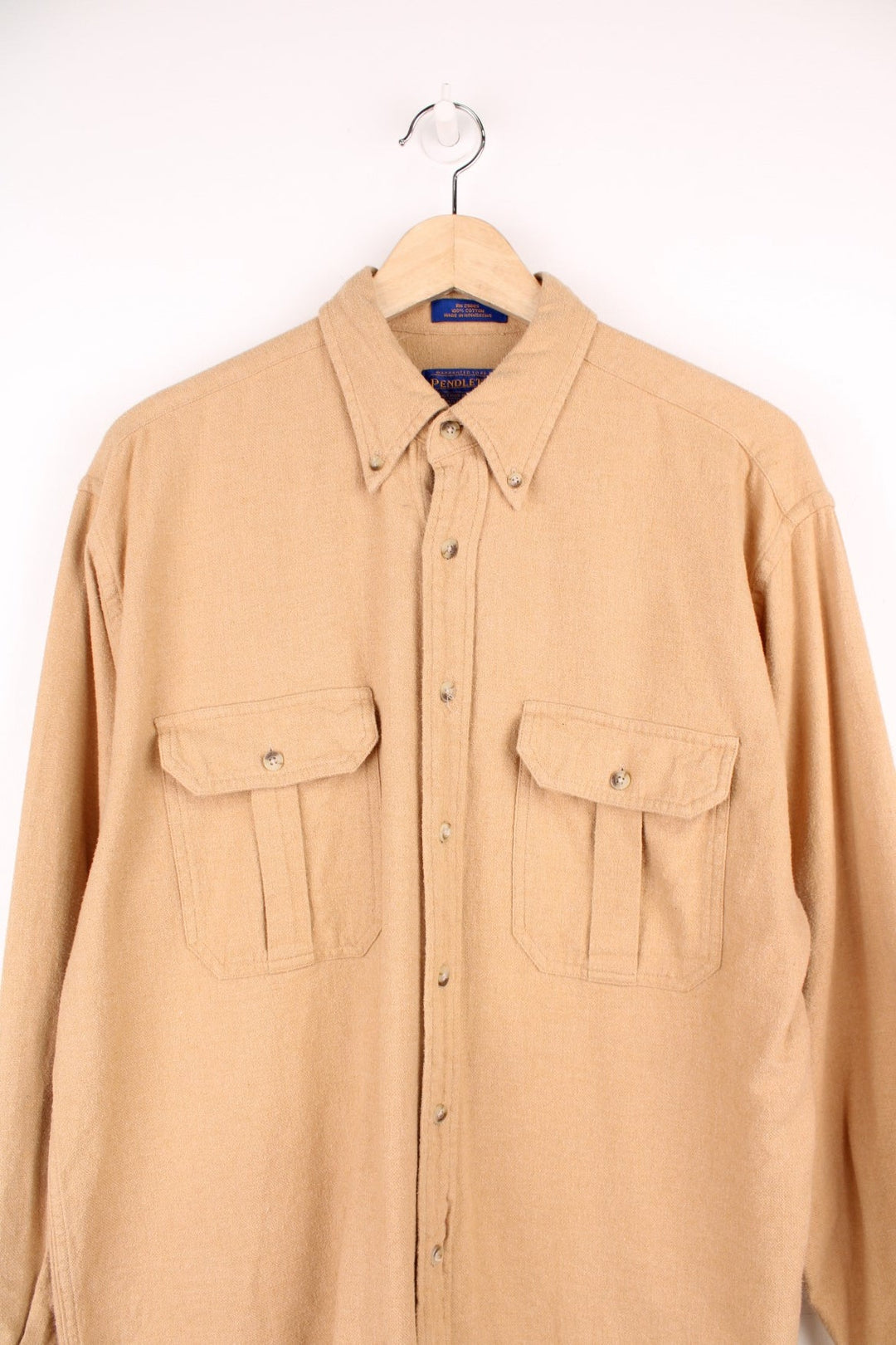 Vintage Pendleton tan flannel shirt with double flap pockets, brown buttons, and a dagger collar.  