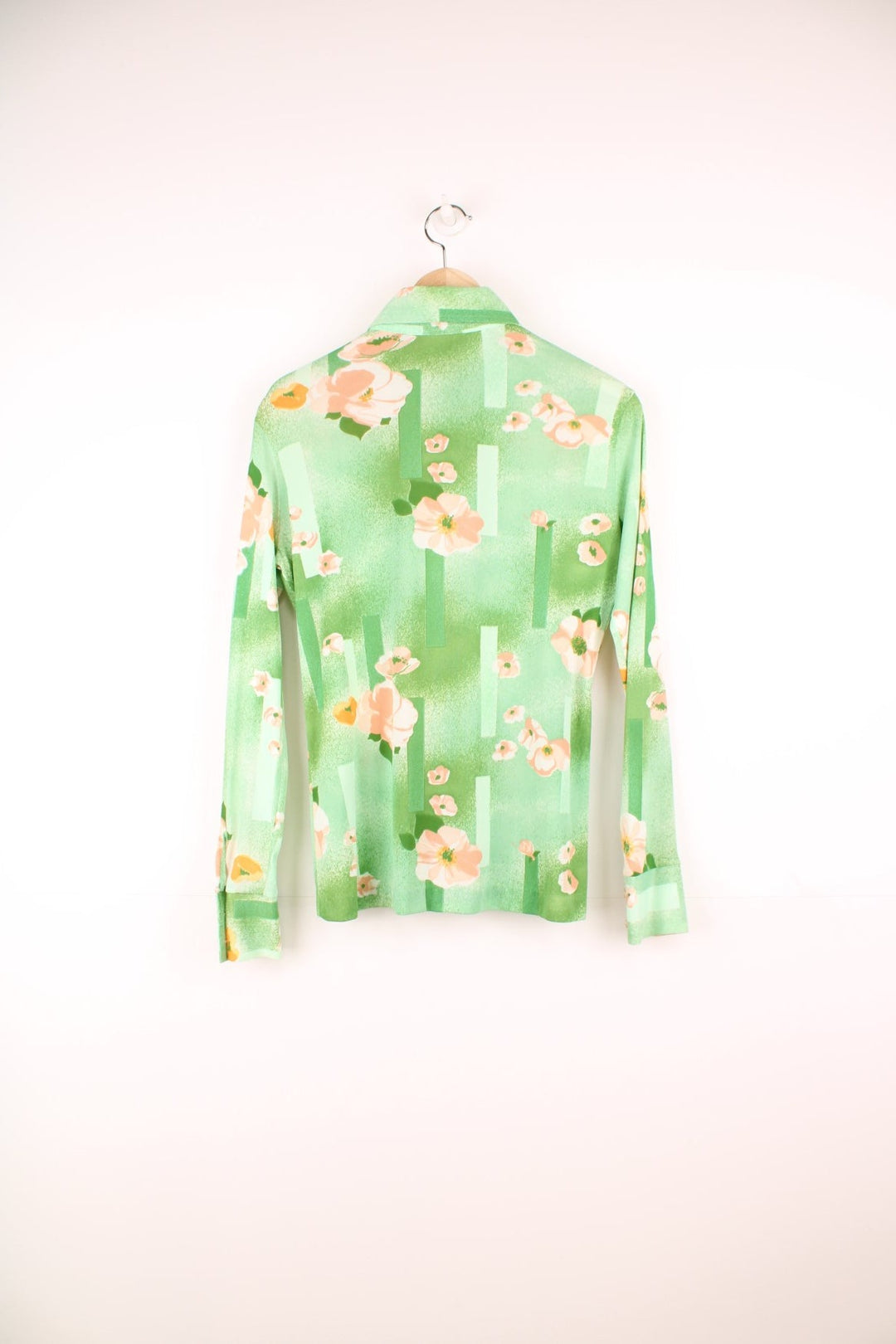 Vintage 70s Styled by Sybil green button through blouse with pink floral pattern and a dagger collar.