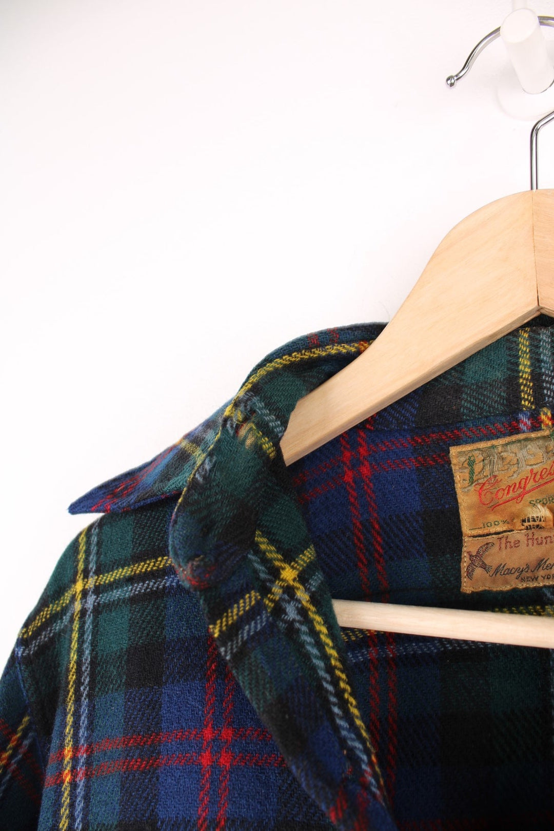 Vintage 40s Congress Sportswear button through wool plaid shirt in blue, green, red and yellow. Features chest pockets, a dagger collar and suede elbow pads. 