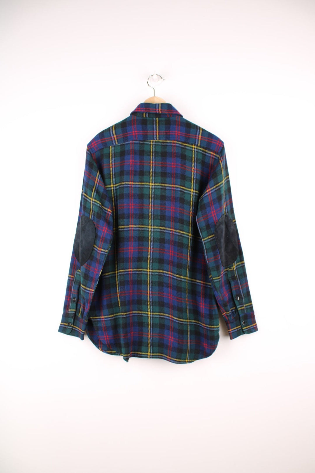 Vintage 40s Congress Sportswear button through wool plaid shirt in blue, green, red and yellow. Features chest pockets, a dagger collar and suede elbow pads. 