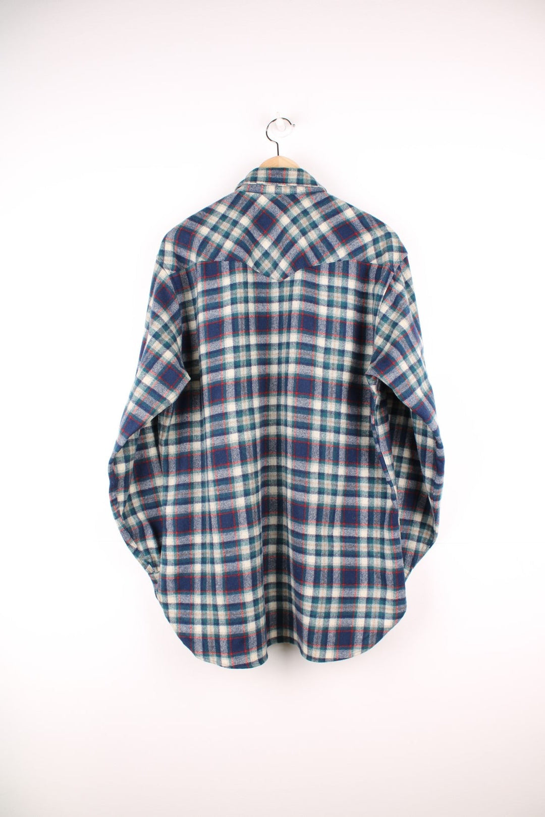 Vintage Pendleton wool plaid Pearl Snap shirt in blue, white and red. Features chest pockets and Western style yolk. 