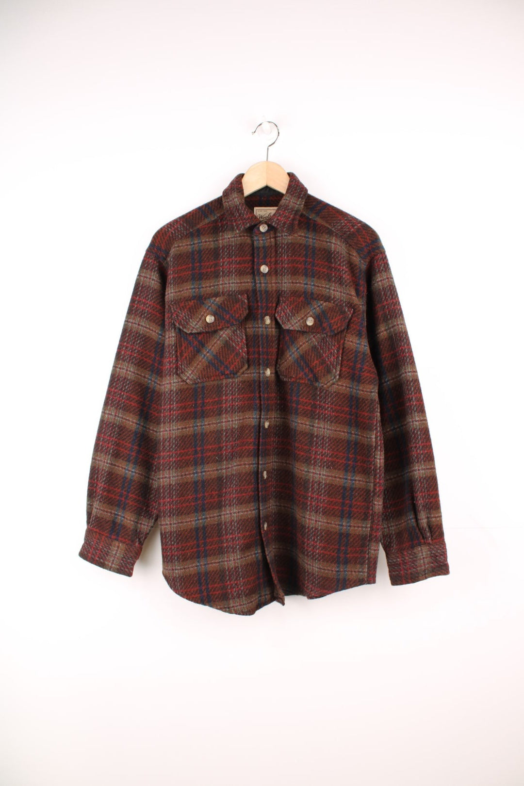 Vintage Woolrich plaid CPO Jacket in burgundy red, blue and grey with chest pockets.