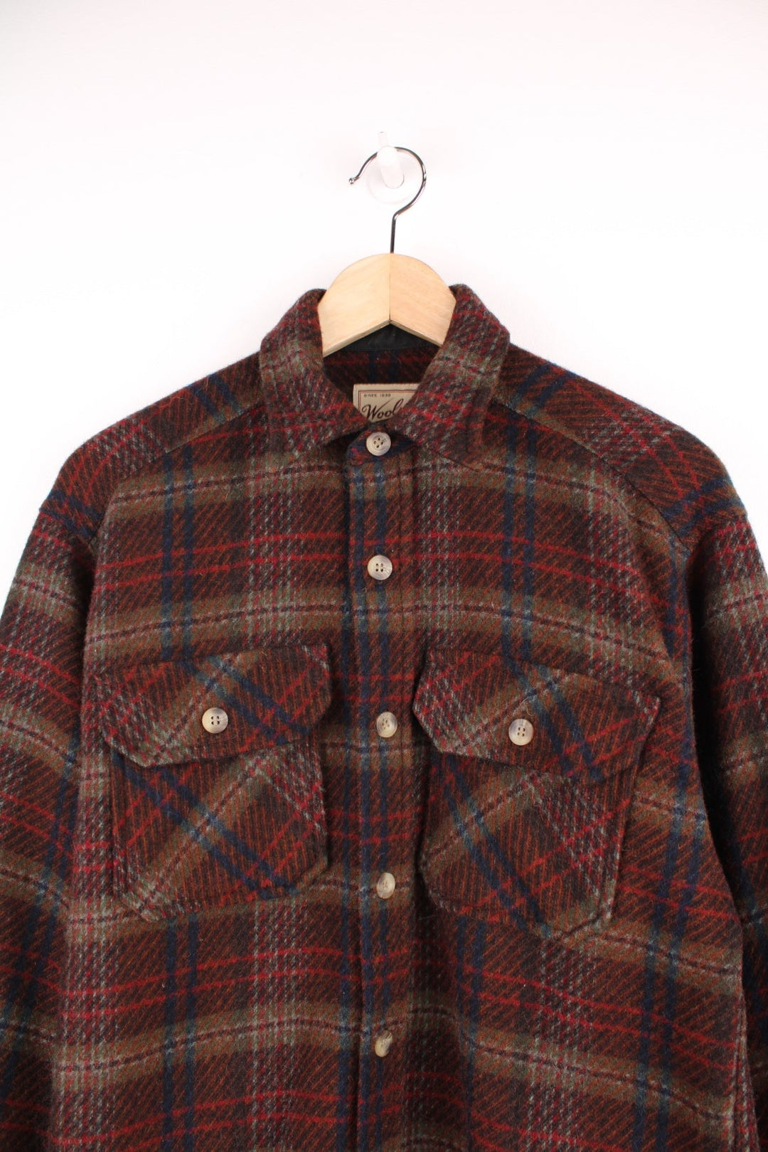 Vintage Woolrich plaid CPO Jacket in burgundy red, blue and grey with chest pockets.