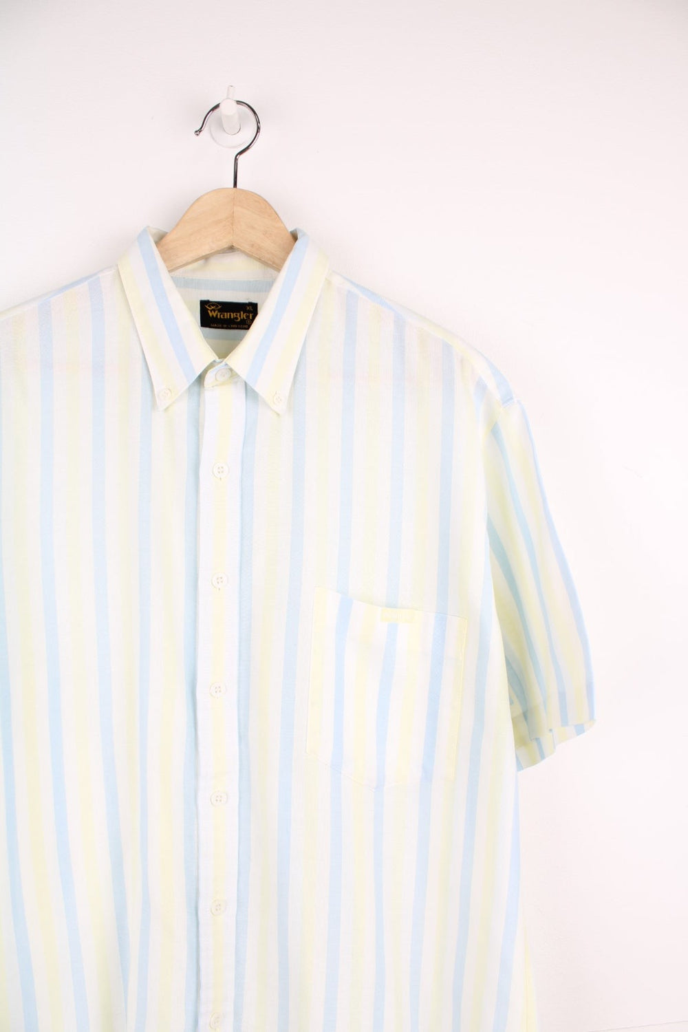 Vintage Wrangler short sleeved striped shirt in white, blue and yellow with chest pocket and embroidered logo.