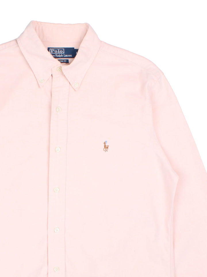 Ralph Lauren button-down shirt pale pink with a small embroidered logo on the chest.