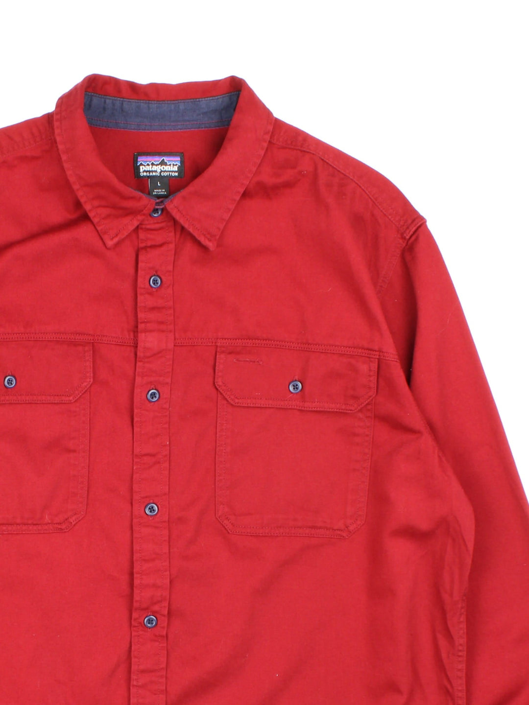 Patagonia overshirt in red with button closure and two chest pockets.