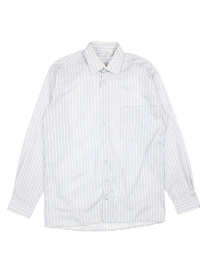 Adidas striped shirt in pale blue, grey and white, with one pocket and a small logo embroidered on.