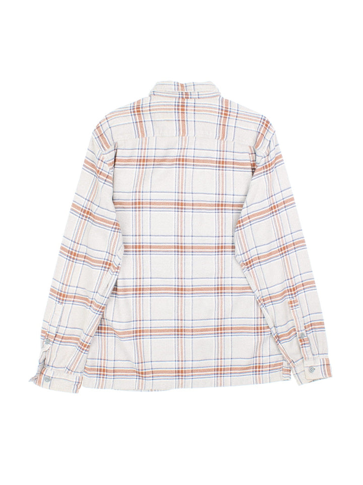 Patagonia flannel shirt in a grey and brown checkered colourway, has two pockets and a small logo tab on the lower left side.