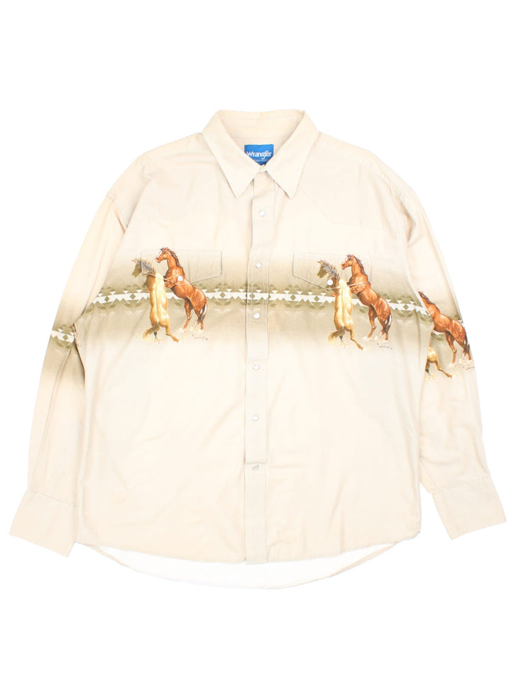 Vintage 70s Wrangler western style horse shirt in a tan colourway with pearl snap closure and two pockets .