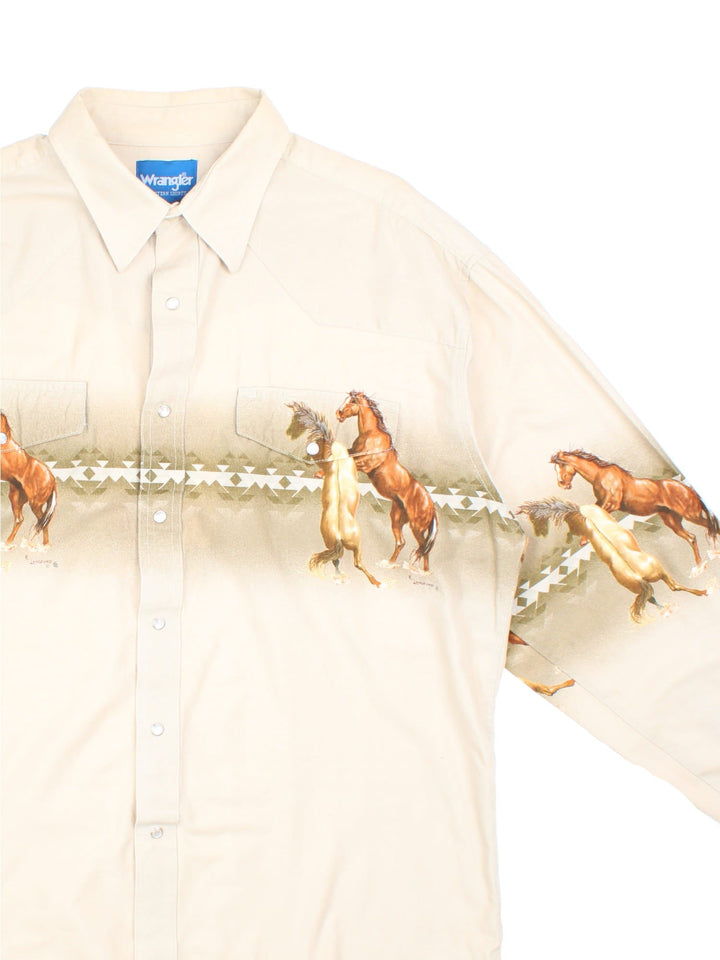 Vintage 70s Wrangler western style horse shirt in a tan colourway with pearl snap closure and two pockets .