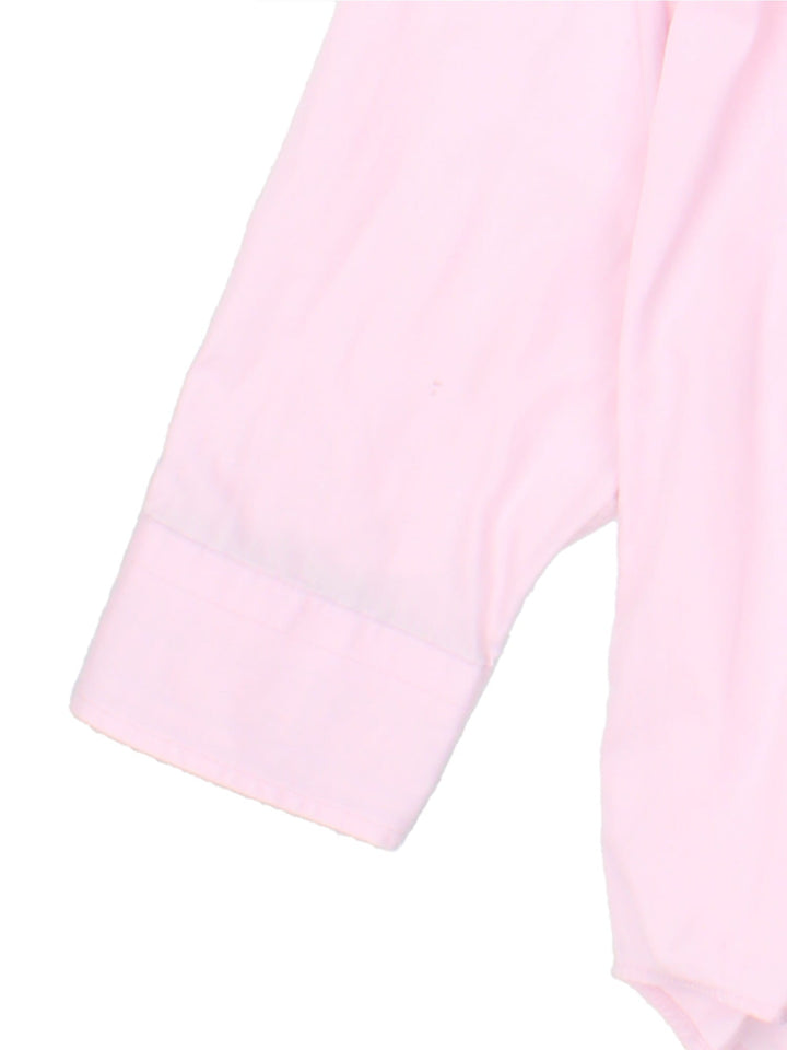 Burberry Shirt in a pink colourway, button up with the logo embroidered on the front.