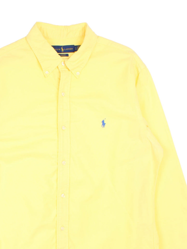 Ralph Lauren Shirt in a yellow colourway, button up with a blue logo embroidered on the front.