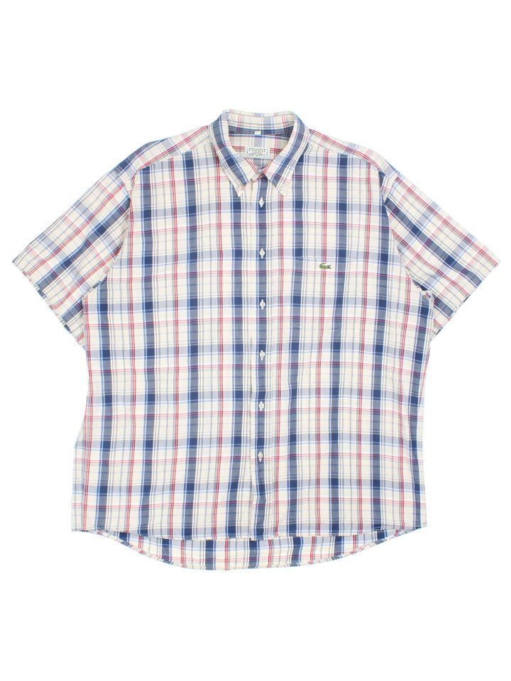 Lacoste Shirt in a blue and multicoloured checked colourway, button up with the contrast logo embroidered on the front.