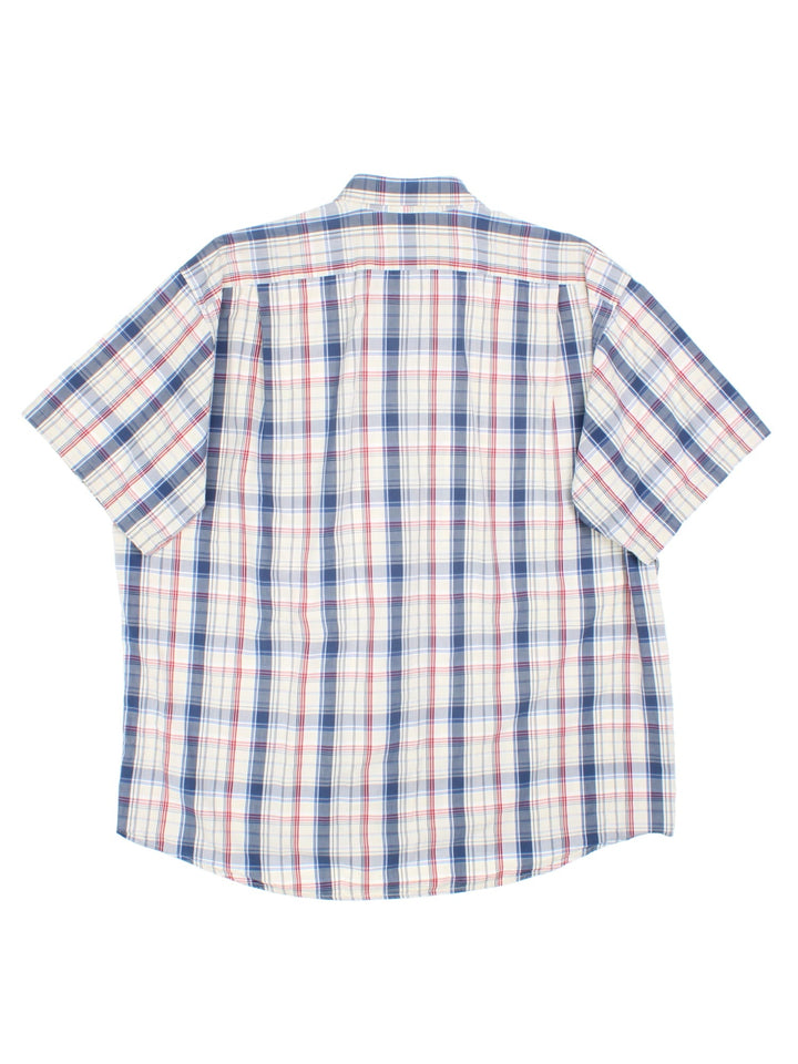 Lacoste Shirt in a blue and multicoloured checked colourway, button up with the contrast logo embroidered on the front.