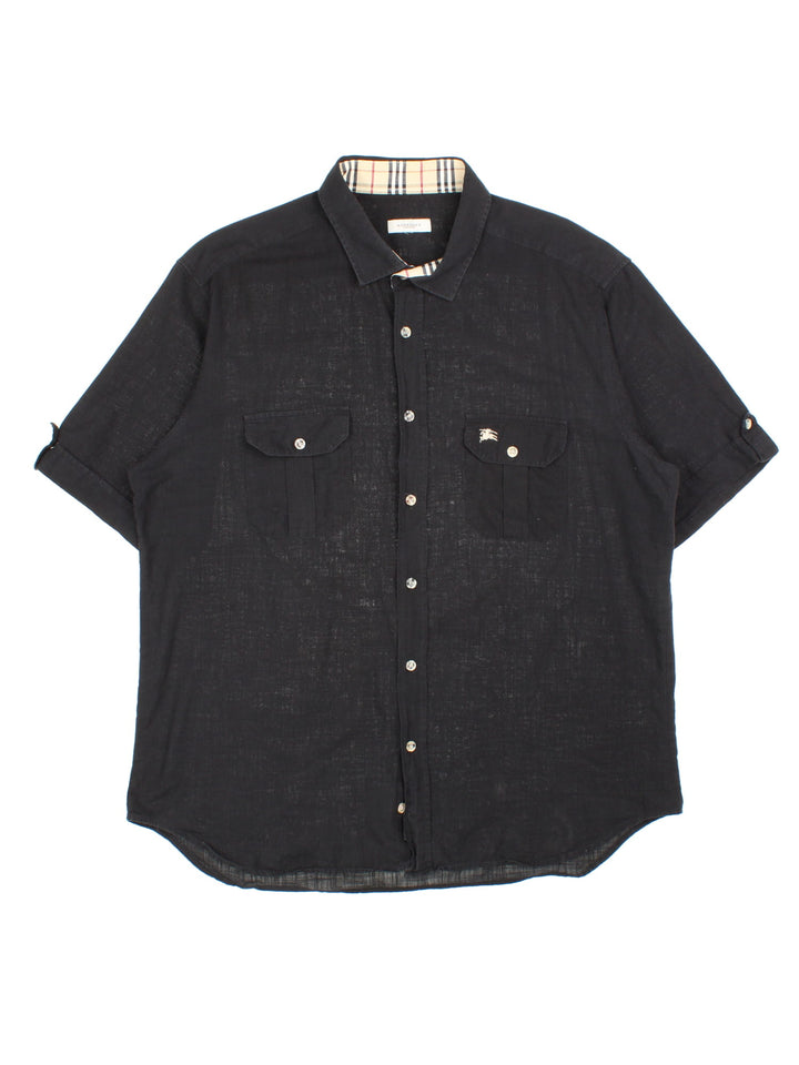 Burberry Shirt in a black colourway, button up with double chest pockets and embroidered pocket logo.