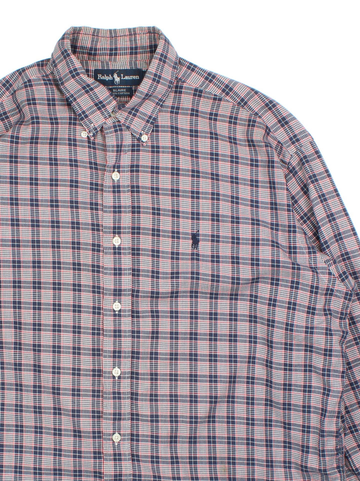 Ralph Lauren Shirt in a blue colourway with checked pattern. Button up with classic logo on the front.