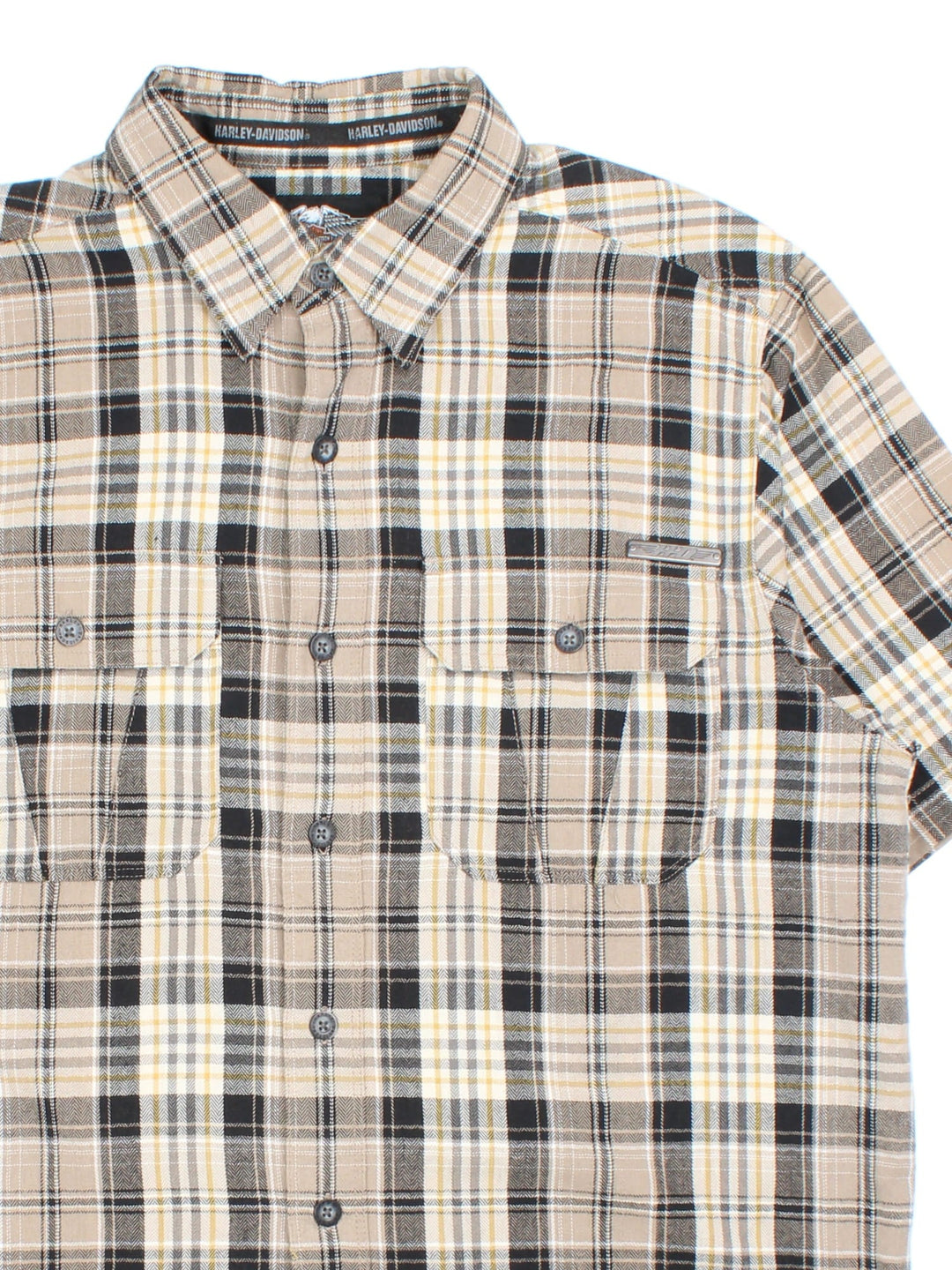 Harley-Davidson Short Sleeve Shirt in a tan colourway with checked pattern.Button up with two pockets on the front and small metal logo just above the pocket.  .