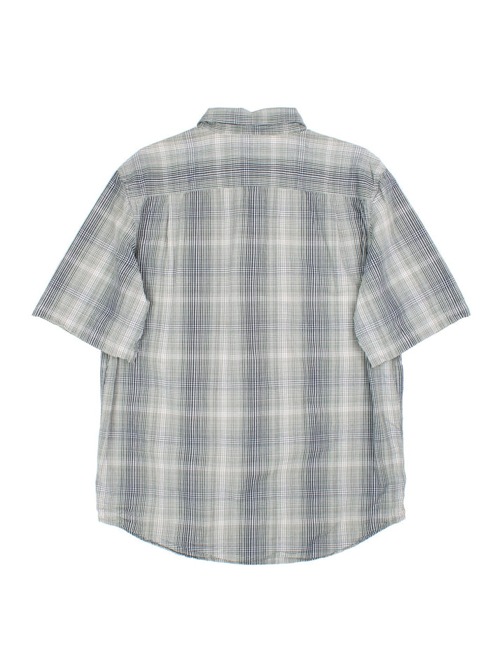 Carhartt Shirt in a blue/white checked colourway. Button up with pocket and branding embroidered on front.