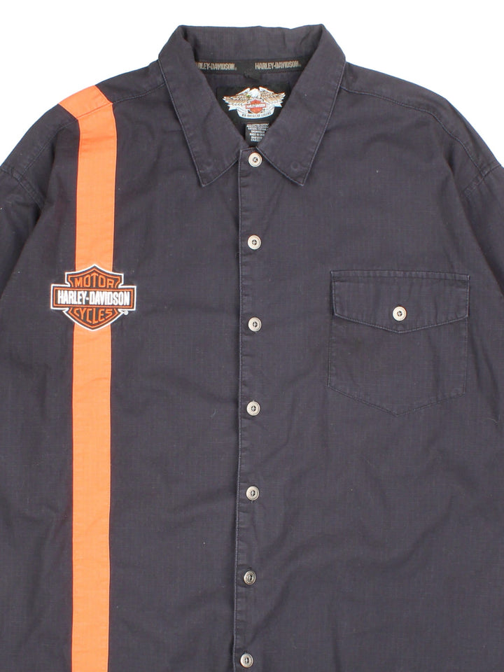 Harley-Davidson Shirt in a black colourway, with contrast orange stripe. Button up with front pocket and embroidered logo.