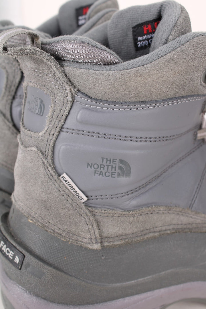 The North Face Snow Boots in a grey colourway with the logo embroidered on the front and sides, high rise insulated boots with adjustable laces.