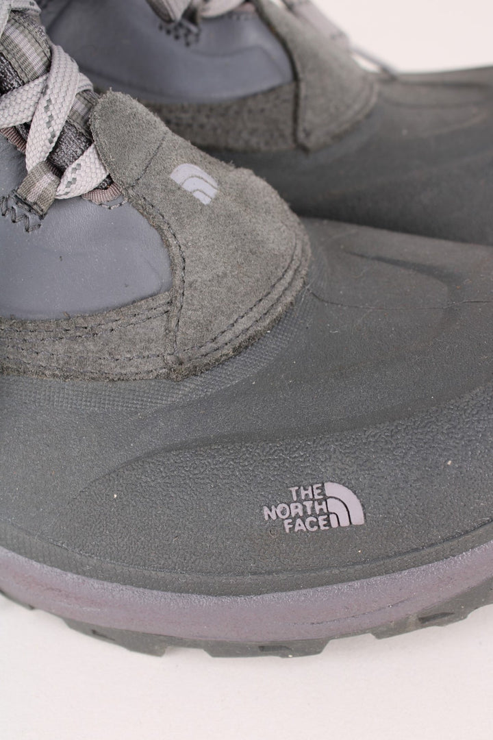 The North Face Snow Boots in a grey colourway with the logo embroidered on the front and sides, high rise insulated boots with adjustable laces.