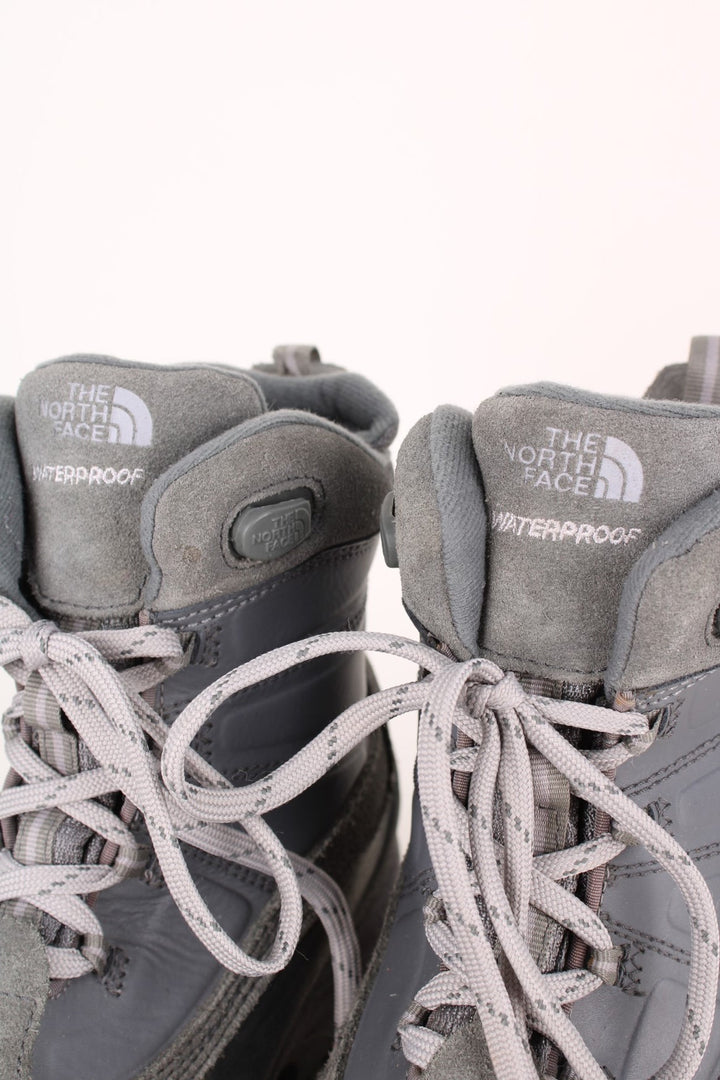 The North Face Snow Boots in a grey colourway with the logo embroidered on the front and sides, high rise insulated boots with adjustable laces.