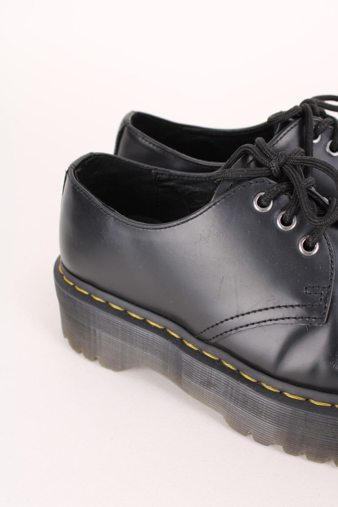 Dr Martens 1461 Boots in a black colourway with a high top sole, and has adjustable laces.