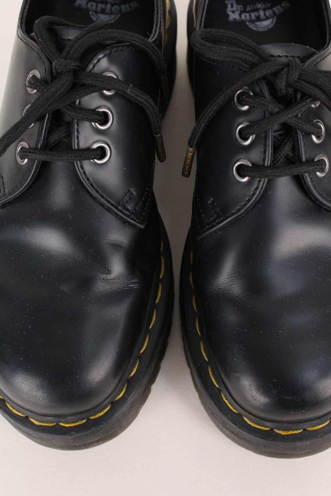 Dr Martens 1461 Boots in a black colourway with a high top sole, and has adjustable laces.