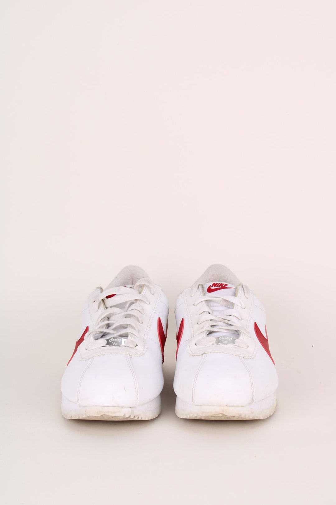 Vintage Nike Classic OG Cortez in a white, red and blue colourway with the swoosh logo embroidered on the sides, and has adjustable laces.