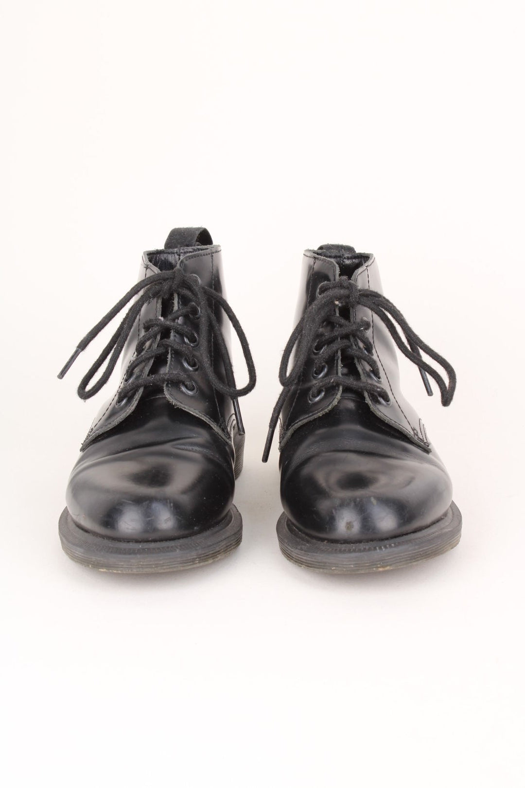 Vintage Dr Martens Emmeline Boots in a black colourway, mid rise boots, and has adjustable laces.