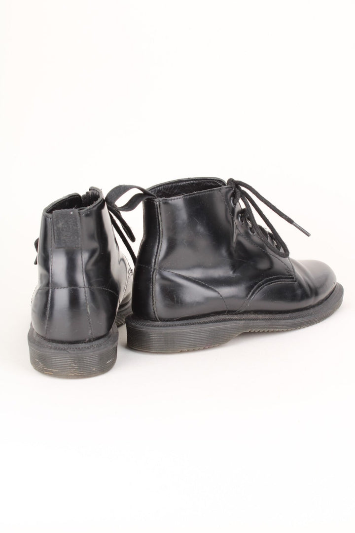 Vintage Dr Martens Emmeline Boots in a black colourway, mid rise boots, and has adjustable laces.