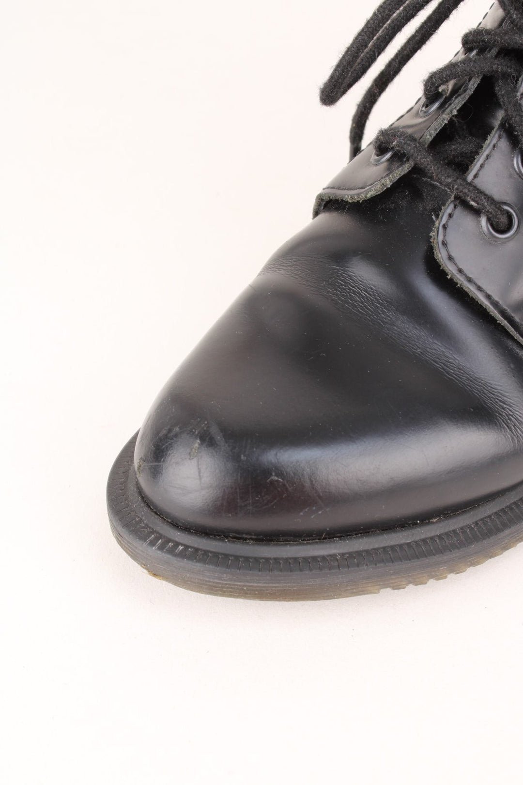 Vintage Dr Martens Emmeline Boots in a black colourway, mid rise boots, and has adjustable laces.