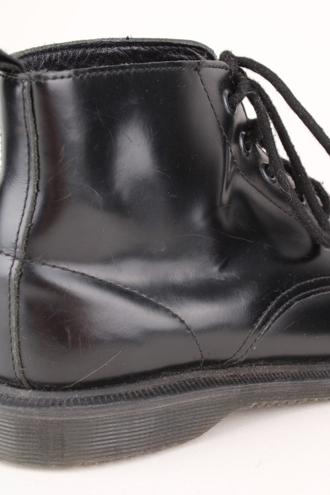 Vintage Dr Martens Emmeline Boots in a black colourway, mid rise boots, and has adjustable laces.