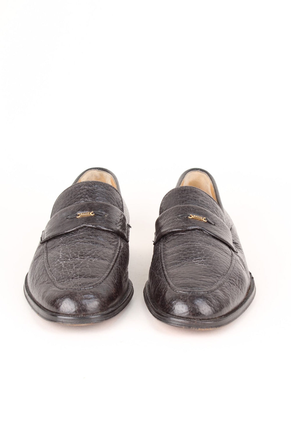 Vintage Bally Loafers in a black colourway with the gold logo badge on the front.