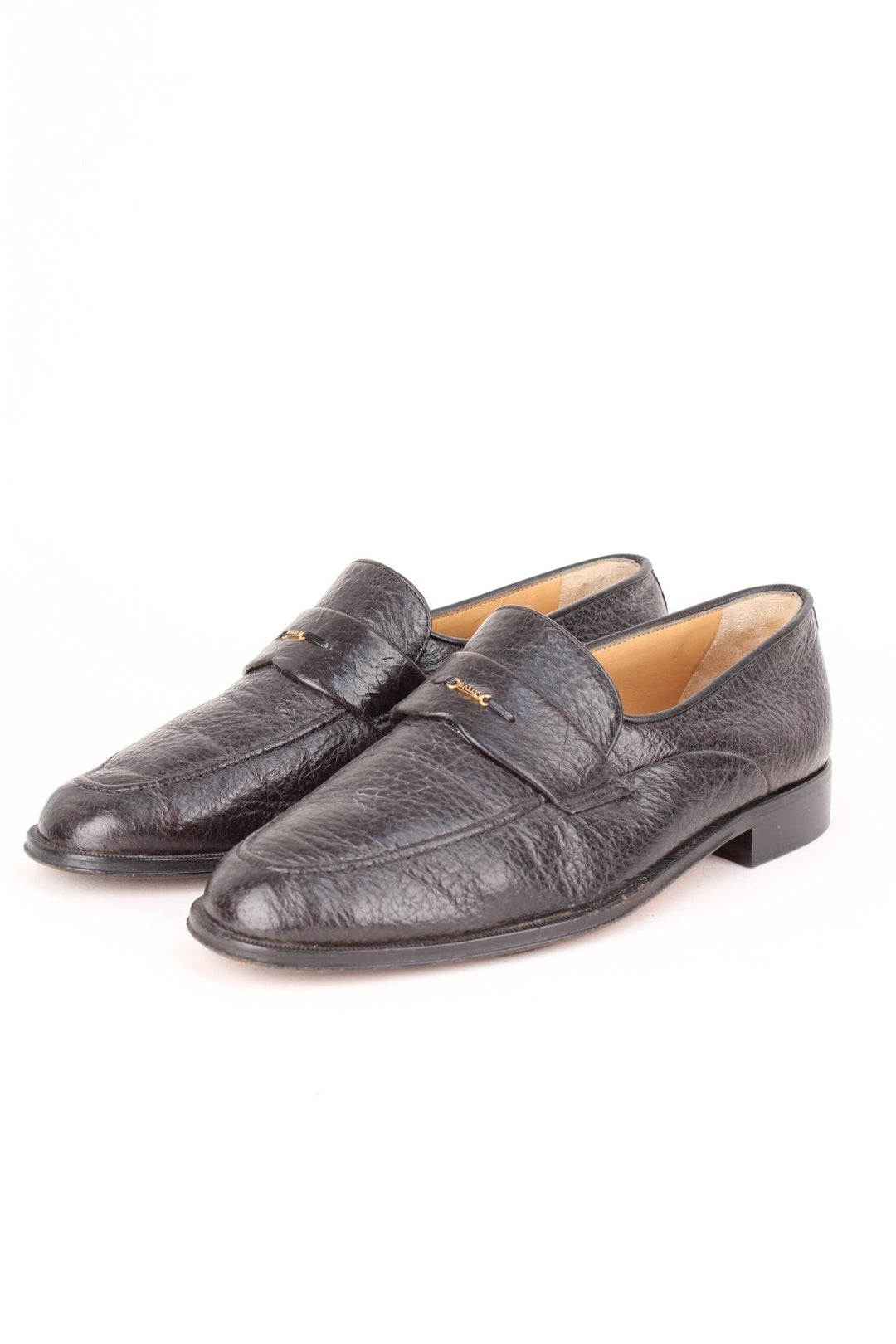 Vintage Bally Loafers in a black colourway with the gold logo badge on the front.