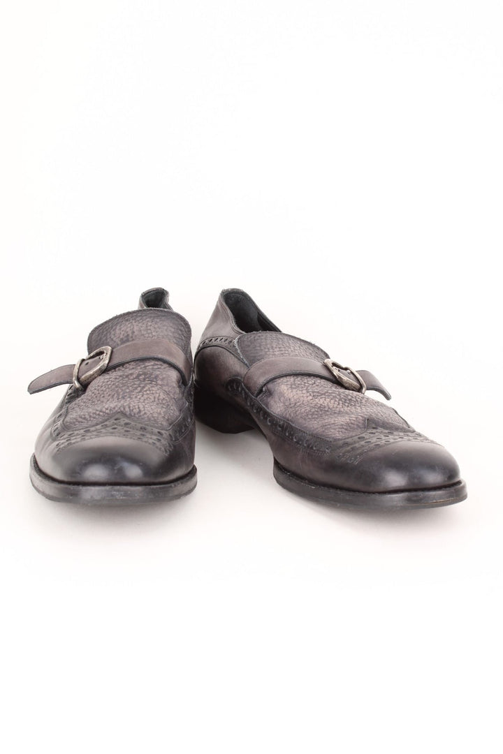 Vintage Dolce & Gabbana Loafers in a black colourway with the western style patterns throughout, and has strap feature on the front.