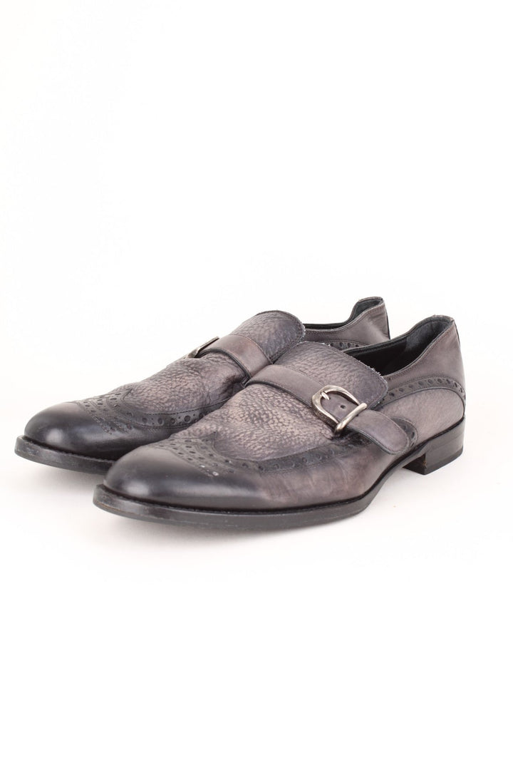 Vintage Dolce & Gabbana Loafers in a black colourway with the western style patterns throughout, and has strap feature on the front.